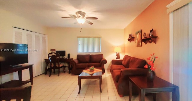 tiled living room featuring ceiling fan