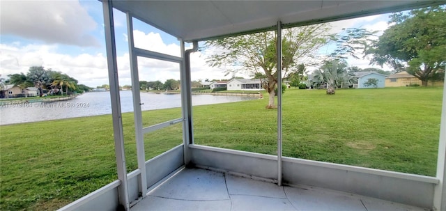 unfurnished sunroom with a water view