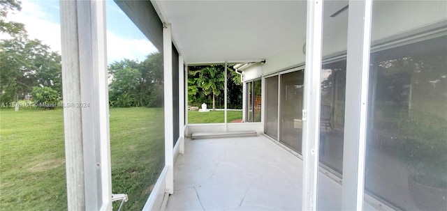 unfurnished sunroom with a wealth of natural light