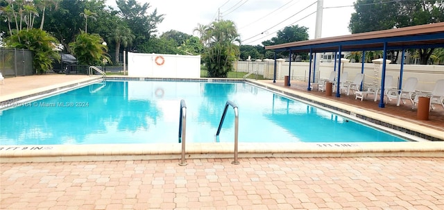 view of swimming pool with a patio