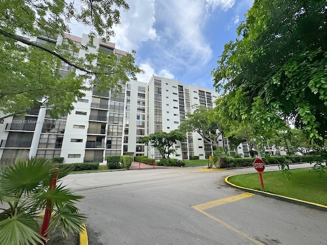 view of property featuring uncovered parking