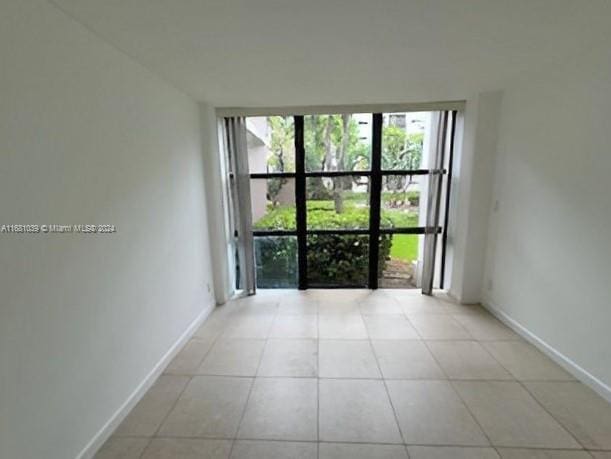 view of tiled spare room