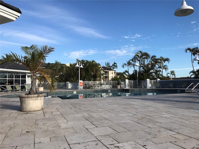 view of swimming pool with a patio area