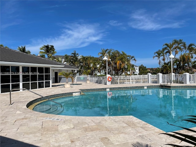 view of swimming pool with a patio area