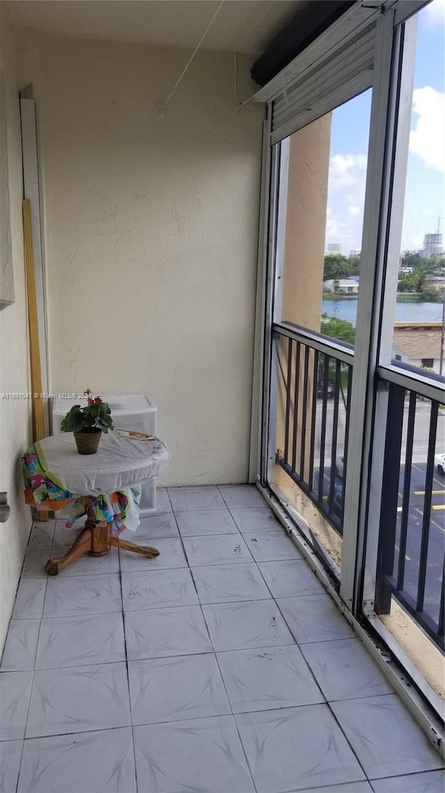 balcony featuring a water view