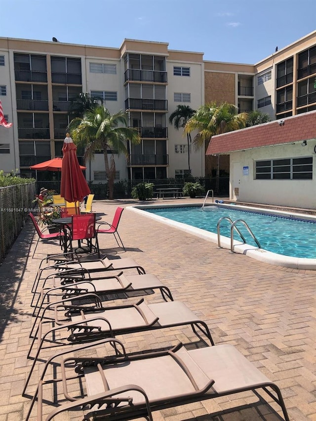 view of swimming pool featuring a patio area