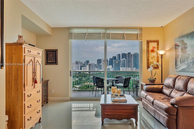 tiled living room featuring a textured ceiling