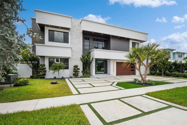 contemporary home with a front lawn