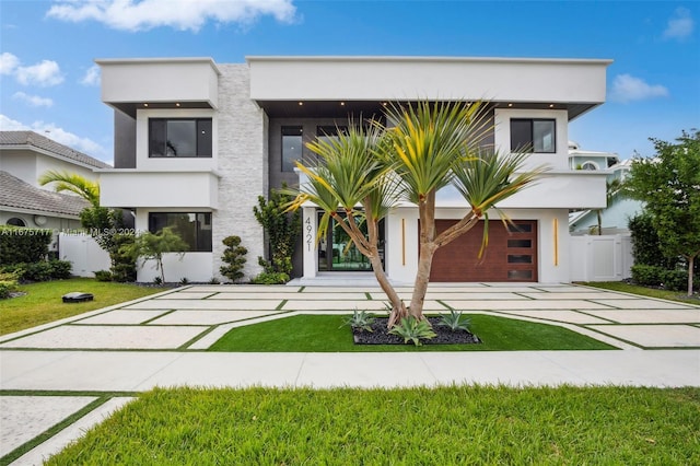 contemporary house with a front lawn