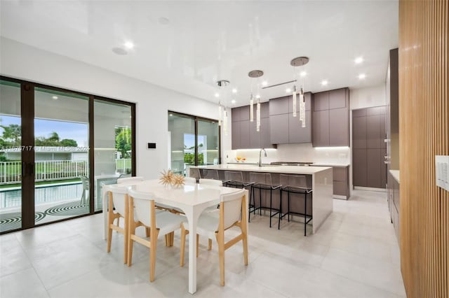 tiled dining room with sink