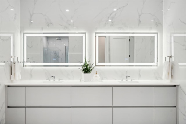 bathroom with vanity and a shower