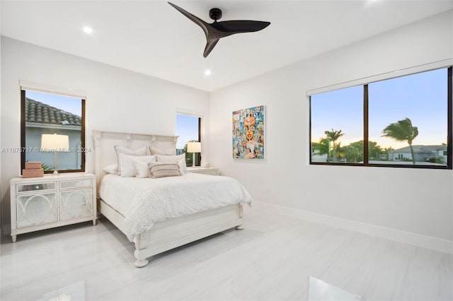 bedroom with multiple windows and ceiling fan