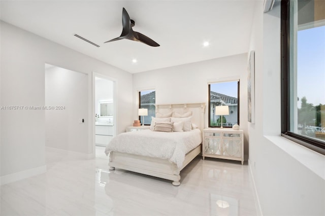 bedroom with connected bathroom and ceiling fan