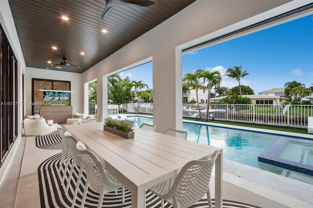 view of swimming pool featuring a patio, an in ground hot tub, and ceiling fan