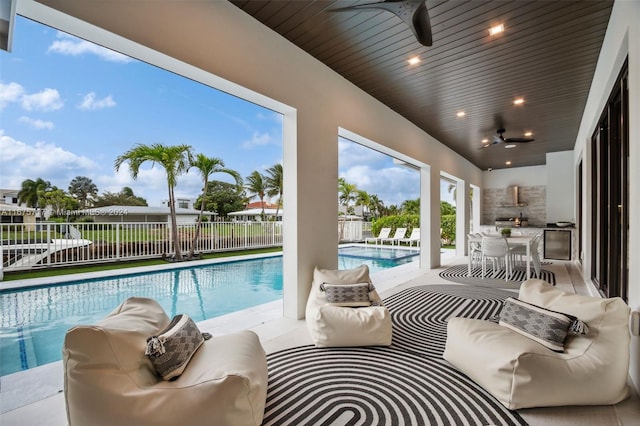 view of swimming pool with a patio area, an outdoor living space, and ceiling fan