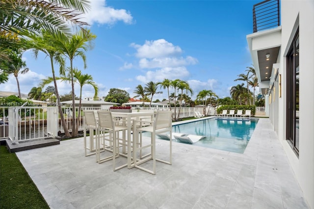 view of pool featuring a patio