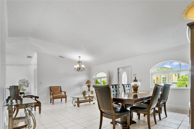 tiled dining room with a notable chandelier and crown molding