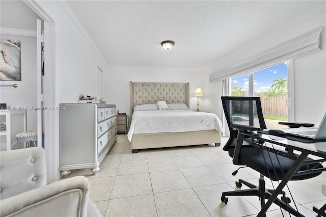 bedroom with a textured ceiling, light tile patterned floors, and crown molding