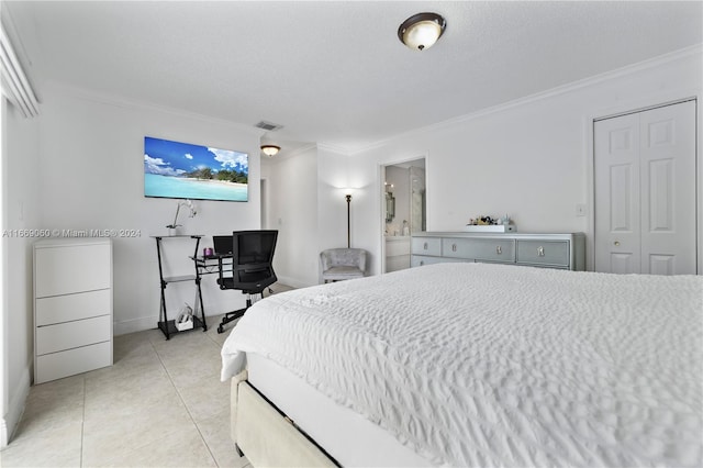 tiled bedroom featuring a textured ceiling, crown molding, and connected bathroom