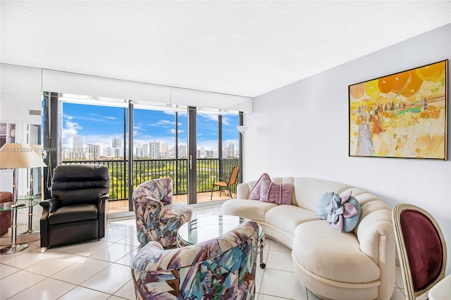 living room with a textured ceiling and light tile patterned floors