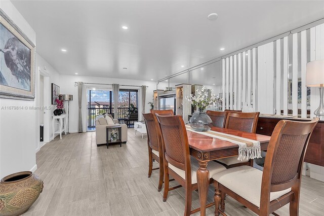 kitchen featuring stainless steel appliances, white cabinetry, tasteful backsplash, and sink