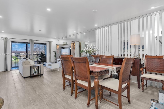 dining space featuring recessed lighting and wood finish floors