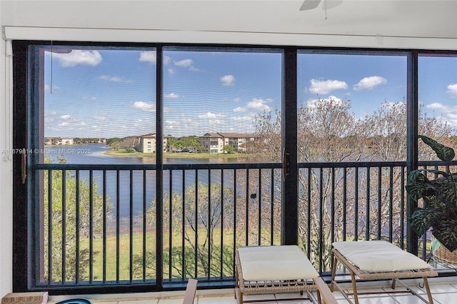 unfurnished sunroom with a water view