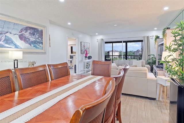 dining area with a textured ceiling