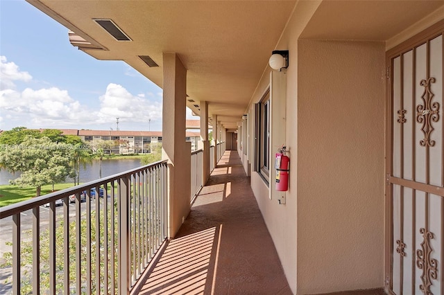 balcony featuring a water view