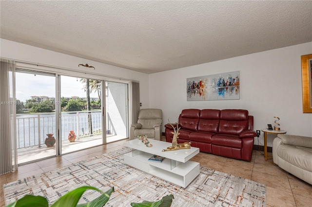 living room with a textured ceiling and tile patterned floors