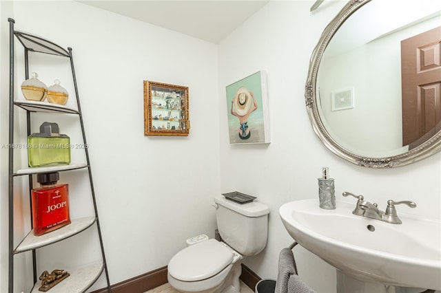 bathroom with toilet and sink