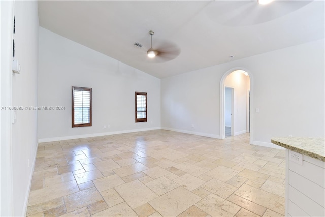 unfurnished room featuring ceiling fan and lofted ceiling