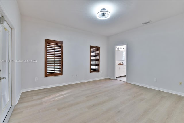 unfurnished room featuring light hardwood / wood-style flooring