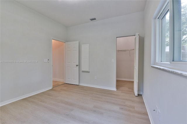 unfurnished room with light hardwood / wood-style floors