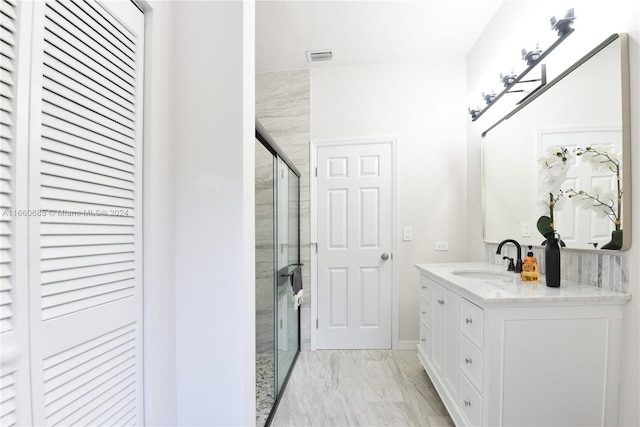 bathroom featuring vanity and walk in shower