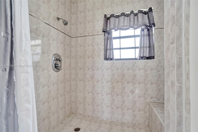 bathroom featuring a shower with curtain