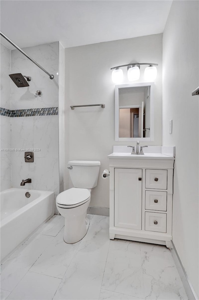 full bathroom with vanity, toilet, and tiled shower / bath combo