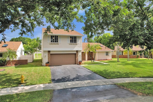 view of front of home with a front yard and a garage