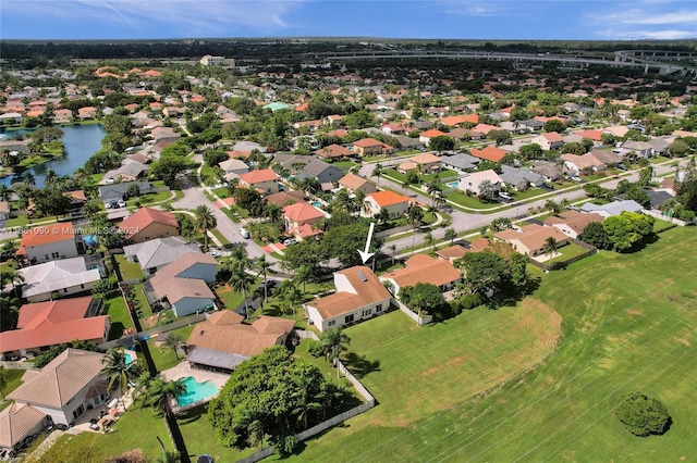 drone / aerial view with a water view