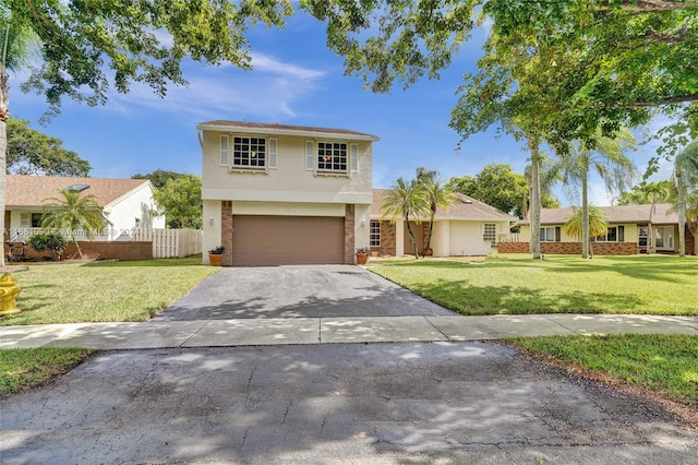 view of front of home featuring a front yard and a garage