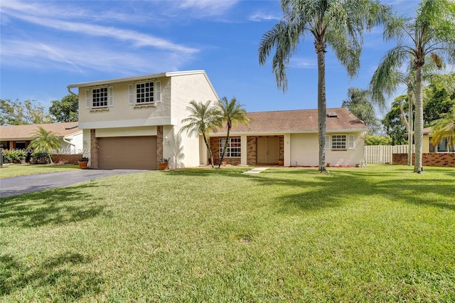 view of front of house with a front yard and a garage