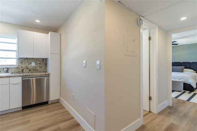 hall featuring electric panel and light wood-type flooring