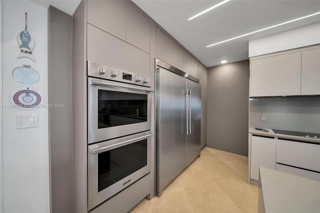 kitchen featuring gray cabinets and stainless steel appliances