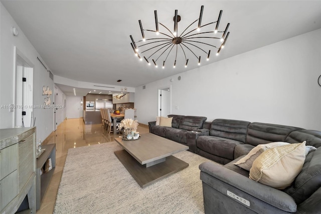 living room featuring light tile patterned floors and a chandelier