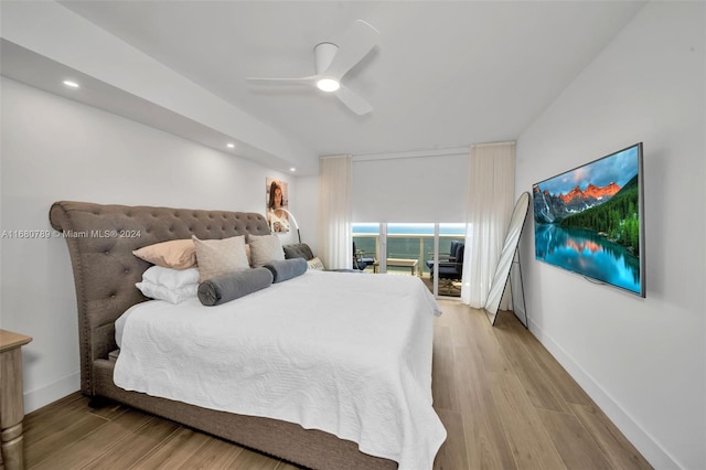 bedroom with access to exterior, light wood-type flooring, and ceiling fan