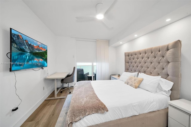 bedroom featuring light hardwood / wood-style flooring and ceiling fan