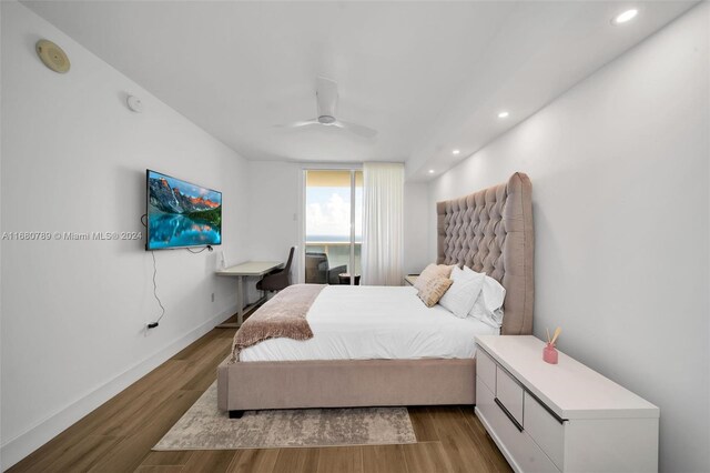 bedroom featuring ceiling fan and hardwood / wood-style flooring