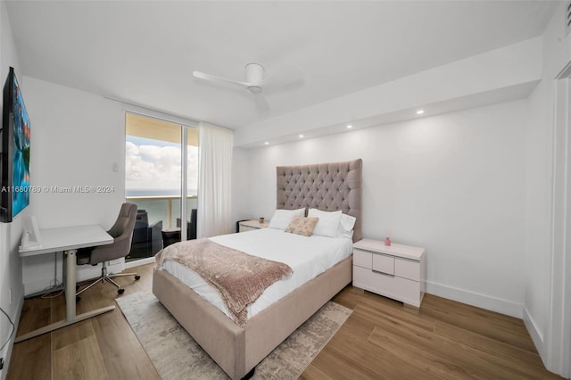 bedroom featuring light hardwood / wood-style flooring and ceiling fan