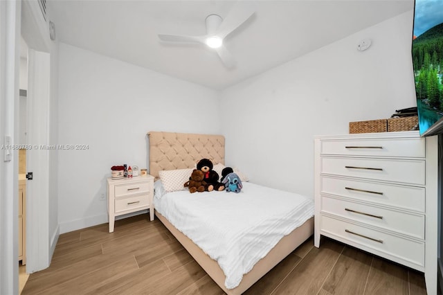 bedroom with light wood-type flooring and ceiling fan