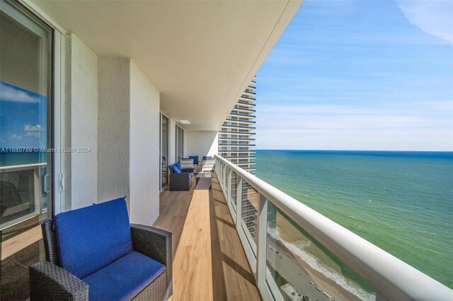 balcony featuring a water view